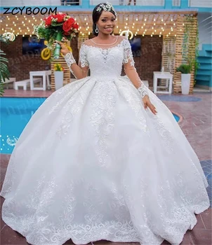 Puošnios baltos ilgos afrikietiškos vestuvinės suknelės be rankovių 2023 Nėrinių aplikacijos Princesės kamuolinė suknelė Sheer O-Neck plius dydžio nuotakos suknelės